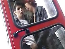 Woman Gives A Handjob In A Phone Booth