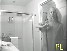 Hidden Bathroom Cam Video Of A Blonde With Tiny Titties