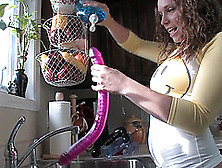 Cute Brunette With A Chubby Body Playing With A Dildo In Her Kitchen