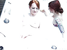 Naked Redheads With Lucious Tits And Indulging Body Drinks Some Punch While They Take A Bath Together In A Jacuzzi.