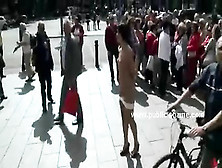Girl In Dress Bends Over The Knees Of Her Mistress In Public And