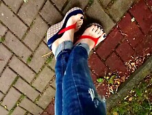Tempting Crossdresser Flaunting Gorgeous Feet In Flip Flops Outdoors