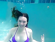Sexy Girl Underwater In Purple Bikini