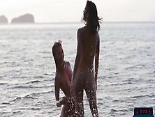 Lesbian Asian And European Girlfriends Playing In The Ocean