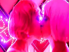 Lesbians Kiss In A Pink-Toned Room