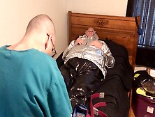 Sensual Domination Scene: Submissive Rubber Boy Restrained And Breath-Controlled In Shiny Silver Nylon