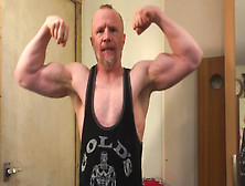 Muscular Daddy Bodybuilder Flexes Big Biceps Wearing A Vest Then Strips Jerks Off And