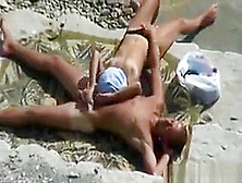 Couple Having Sex Outdoors At The Beach