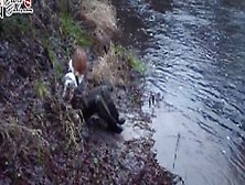 Russian Blonde In Muddy Chest Waders Enjoying Riverside Mud