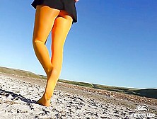 Barefoot Walking By Dried Up Lake In Yellow Pantyhose
