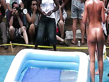 Naked Girls Are Wrestling In Front Of A Huge Crowd