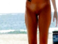 Brunette Gets Naked For Hoola Hoop Stunt On Beach