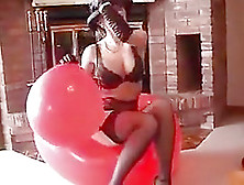 Blowing The Huge Red Balloon To Pop