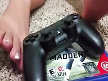 Girl With French Pedicure Playing With Playstation Controller With Her Sexy Feet