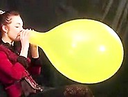 Russian Alissa Blows To Pop Yellow Balloon