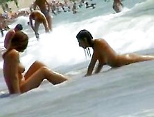 Smoking Hot Brunettes Are Relaxing On The Nudist Beach
