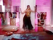 Busty Belly Dancer Gets Undressed And Dances