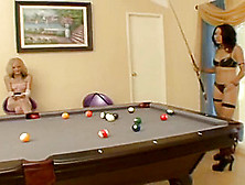 Horny Chick Playing Pool Decides To Fuck Her Gf With A Strap-On.