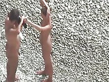 Couple Nude In The Beach Playing With Themselves