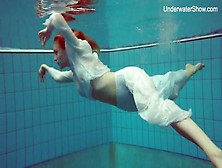 Elegant Redhead Goes Swimming In Her Sexy Clothes
