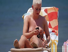 Emo Chick With Big Tits And Pierced Nipples Sunbathing On Topless Beach