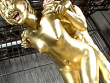Shiny Gold Paint Covers The Asian Girl And Her Man As They Fuck