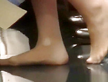 Sexy Hostess Resting Her Nylon-Clad Feet