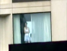 Voyeur Tapes The Neighbor Girl Changing Clothes In Her Apartment