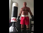 Working The Bag In Red Boxing Trunks
