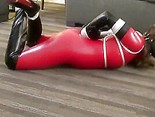 Red Latex Catsuit Skank Muzzled And Tied Up