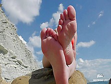 Sexy Barefoot Soles And Toes Teasing On The Sea Beach