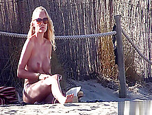 Gorgeous Blonde Babe Flaunts Her Spectacular Body On Topless Beach