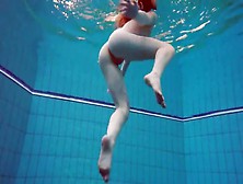 Swimming Redhead Strips Underwater To Tease Us
