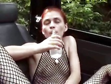 Skinny Redhead In Fishnets Fills Her Pussy