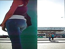 A Brunette Girl Showing Her Tight Ass In Jeans