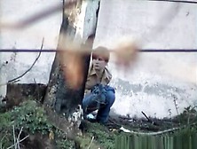 Girl Pees Next To Big Wall