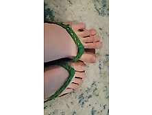 Tops Of Feet In Flip-Flops