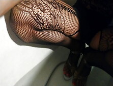 Wetlook In Bathroom In Black Fishnet Body,  Denim Shorts And High Heels Shoes