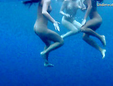 Luscious Honeys Love Undressing While Diving In The Water