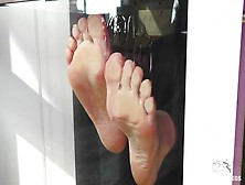 My Barefoot Wrinkled Soles Rubbing Against The Glass And Squeezing Juicy Strawberries