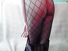 Hot Young Girl With Fishnets And Mini Plaid Skirt