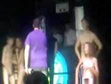 2 Russian Couple Have A Striptease Game On Stage In A Disco