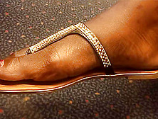 Ultra Close-Up Of Beautiful Ebony Feet On The Train