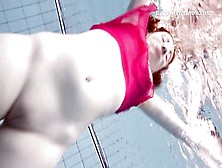 Ginger Cutie Filmed Underwater While Swimming Fully Naked
