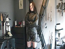 Girl Strapped Into A Fetters Leather Straitjacket