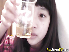 Asian Teen Urinates In Plastic Glass