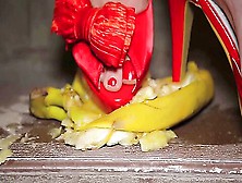 Passionate Woman Crushing Some Bananas With Her High Heels On The Stairs