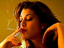 Sexy Brunette Has A Cigarette