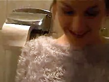A Girl Wets Her Diaper On The Toilet