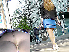 Upskirt Voyeur Video Shows Plump Female In A-Line Skirt